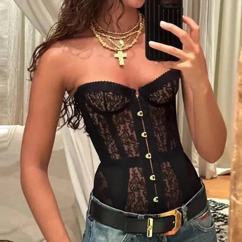 Black lace corset top with gold buttons, styled with jeans and layered necklaces for women's fashion