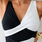 Black and white color block wrap top with deep V-neck, stylish women's fashion