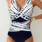 Women's navy and white patterned one-piece swimsuit with V-neck and wrap design