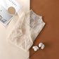 Delicate lace women's blouse with floral pattern, soft beige tone, stylish fashion top