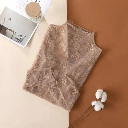 Elegant women's lace top with floral pattern, soft beige tone, perfect for fashion outfits
