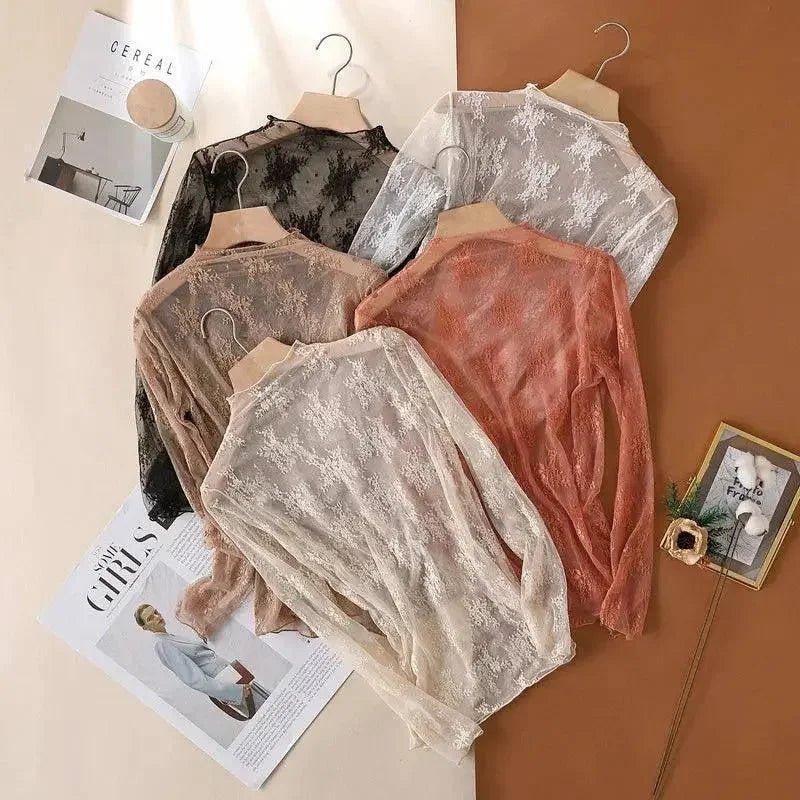 Women's sheer lace tops in black, white, blush, and peach — elegant fashion layering pieces