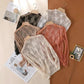 Women's lace long sleeve tops in black, white, beige, and pink, styled on hangers with fashion magazines
