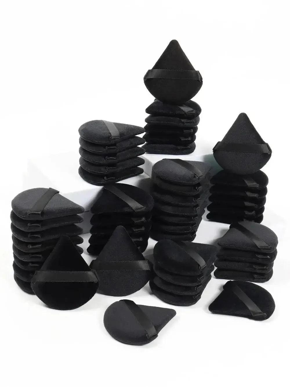 Black makeup sponges in triangle and teardrop shapes for beauty application