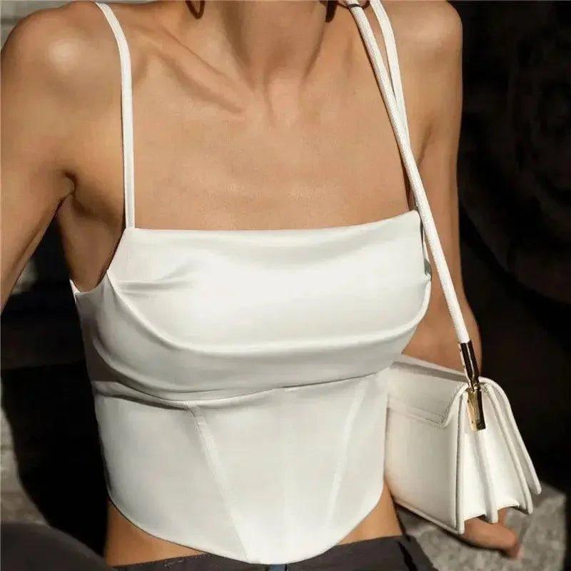 White satin camisole top with corset waist, paired with matching handbag for women's fashion