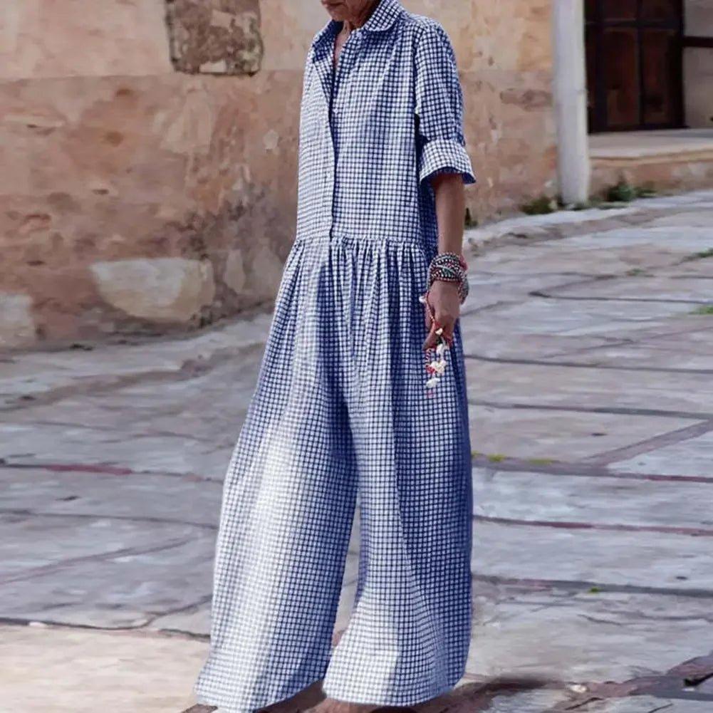 Woman wearing blue and white gingham jumpsuit with wide legs, casual summer fashion