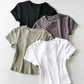 Women's basic crop tops in black, gray, olive, and white — stylish, comfortable fashion essentials