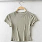 Olive green ribbed crop top for women, short sleeve fashion tee on hanger
