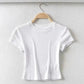 White ribbed crop top for women, stylish short sleeve fashion tee on hanger