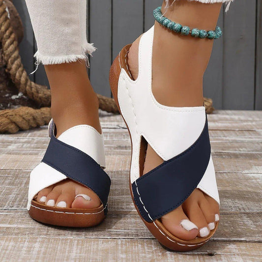 White and navy blue women's wedge sandals with crisscross straps, perfect for summer fashion