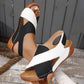 Women's white and black strappy sandals with brown wedge sole, perfect for summer fashion