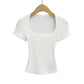 White ribbed women's crop top with square neckline, short sleeves, on wooden hanger