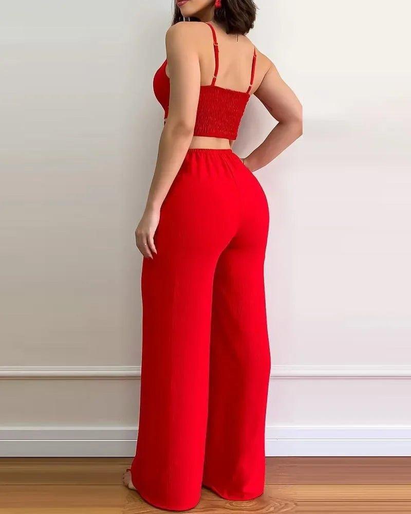 Red women's two-piece set with crop top and wide-leg pants, stylish fashion outfit