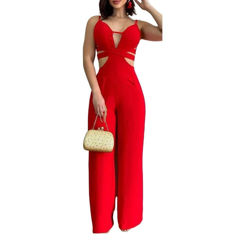 Red cutout jumpsuit for women with wide legs, paired with gold clutch bag, perfect for fashion events