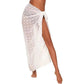 White polka dot beach wrap skirt with side slit, tied at waist for summer fashion