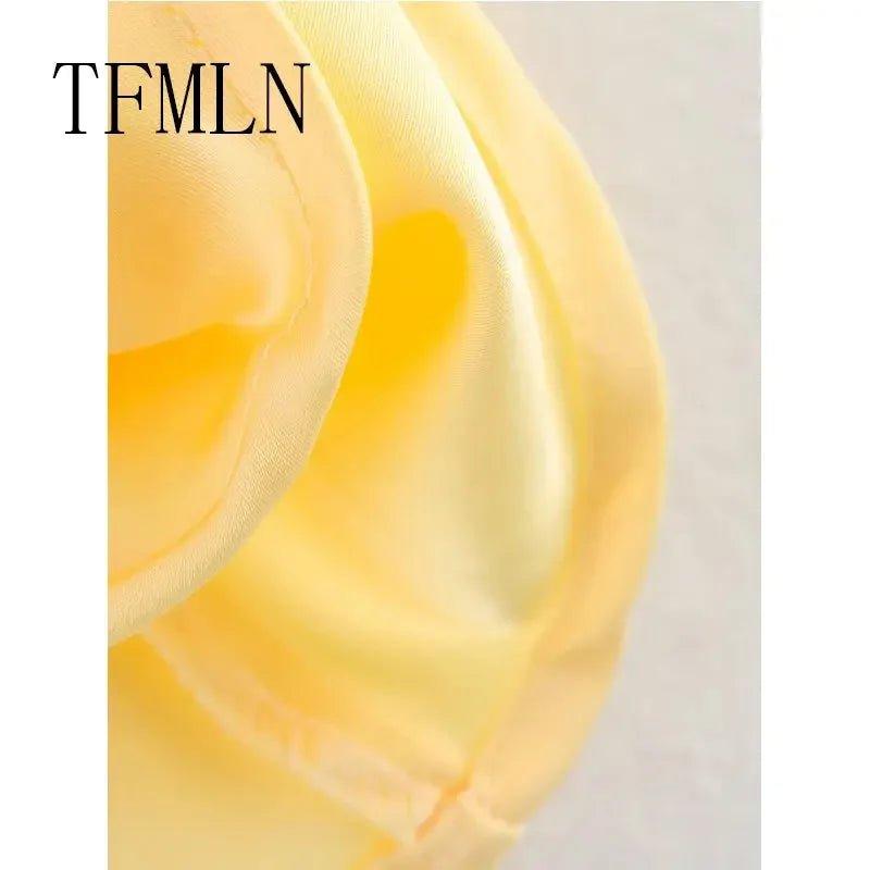 Soft yellow satin fabric close-up, smooth texture for women's fashion apparel