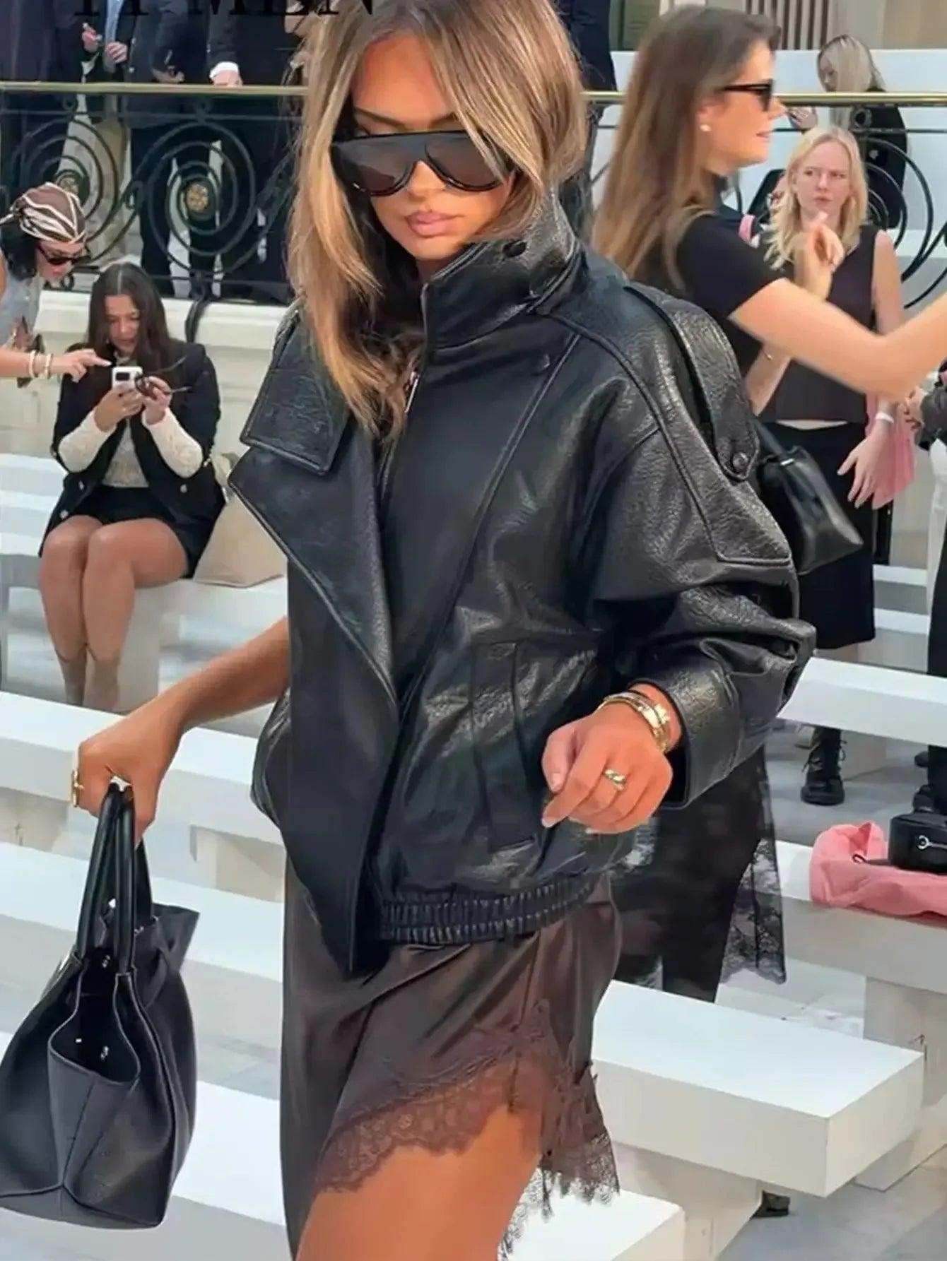 Woman in black leather jacket and lace skirt at fashion show, stylish streetwear outfit