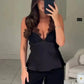 Woman in black lace-trim camisole top and pants, taking mirror selfie for fashion outfit inspiration