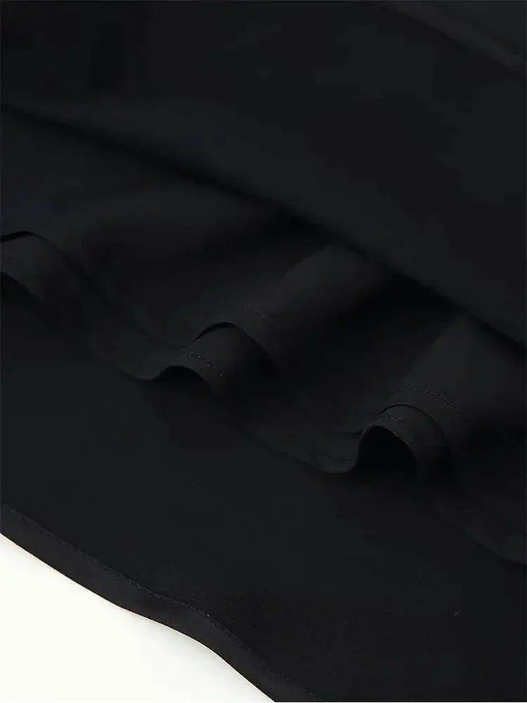 Black women's fashion skirt with ruffled hem detail, soft fabric texture