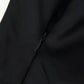 Black women's fashion garment with hidden zipper detail, sleek fabric texture