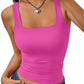 Woman wearing vibrant pink square neck crop tank top with ruched detail, paired with denim jeans