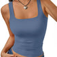 Woman wearing blue square neck crop tank top with heart necklace, fashion style