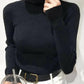 Black ribbed turtleneck sweater for women, stylish fashion top with white pants and belt