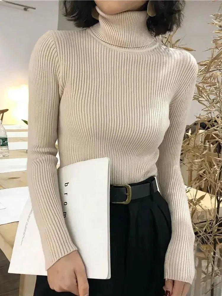 Beige ribbed turtleneck sweater for women, stylish long sleeve top with black pants and belt
