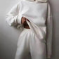Woman in white hoodie and matching sweatpants, stylish casual fashion set