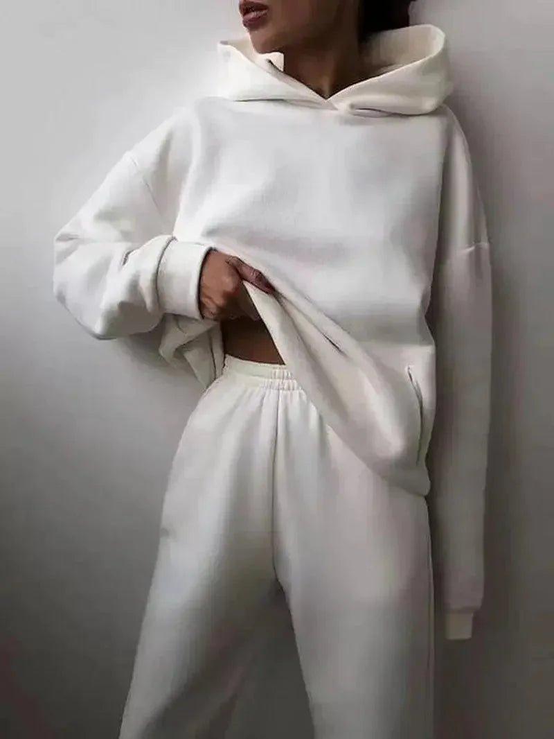 Woman in white hoodie and matching sweatpants, stylish casual fashion set