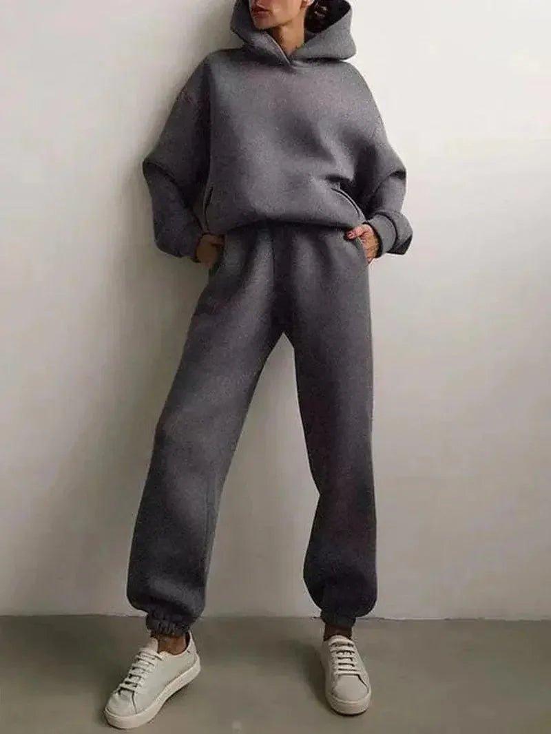 Woman in cozy gray hoodie and matching joggers, casual fashion outfit