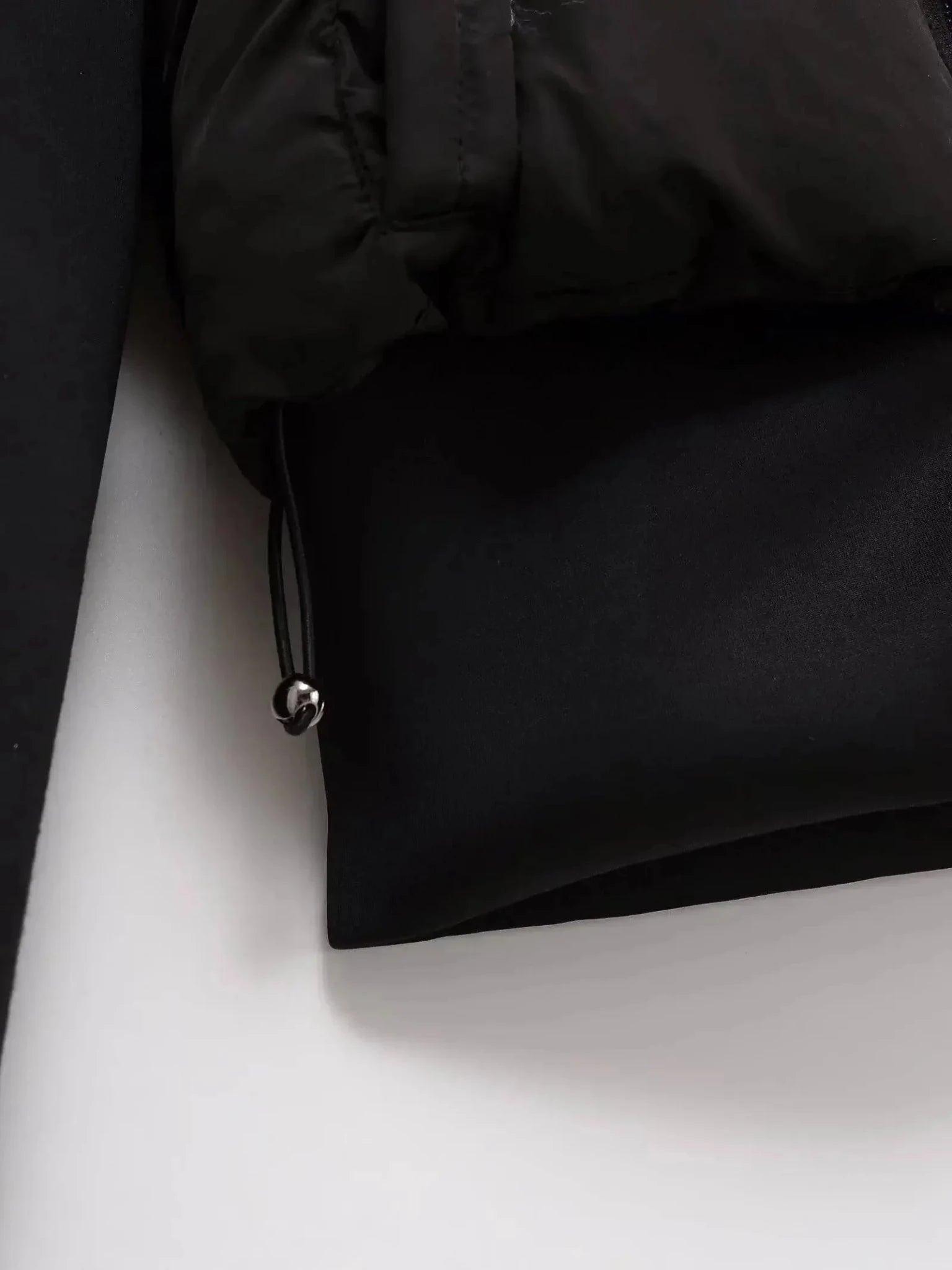 Black puffer jacket with drawstring hem and metallic toggle, women's fashion outerwear