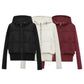 Women's hooded puffer jackets in black, cream, and burgundy — cozy winter fashion essentials