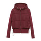 Burgundy women's hooded puffer jacket with front zipper and side pockets, stylish winter outerwear
