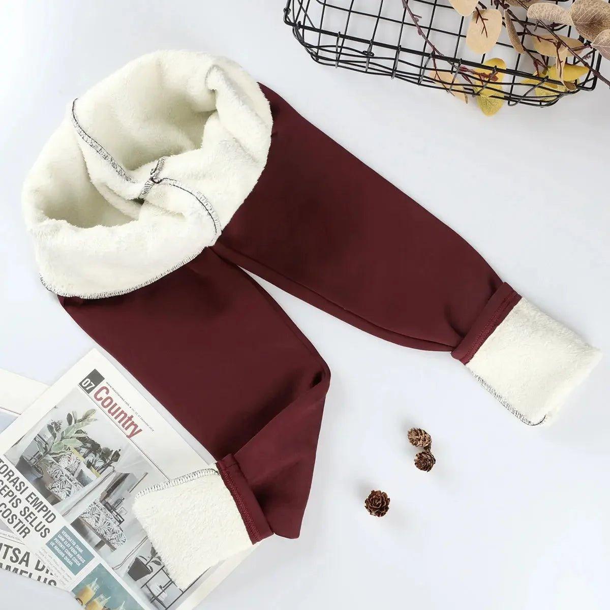 Cozy burgundy fleece-lined joggers with white sherpa cuffs, perfect for women's winter fashion