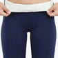 Woman modeling navy blue fleece-lined leggings with cozy white waistband, perfect for winter fashion.