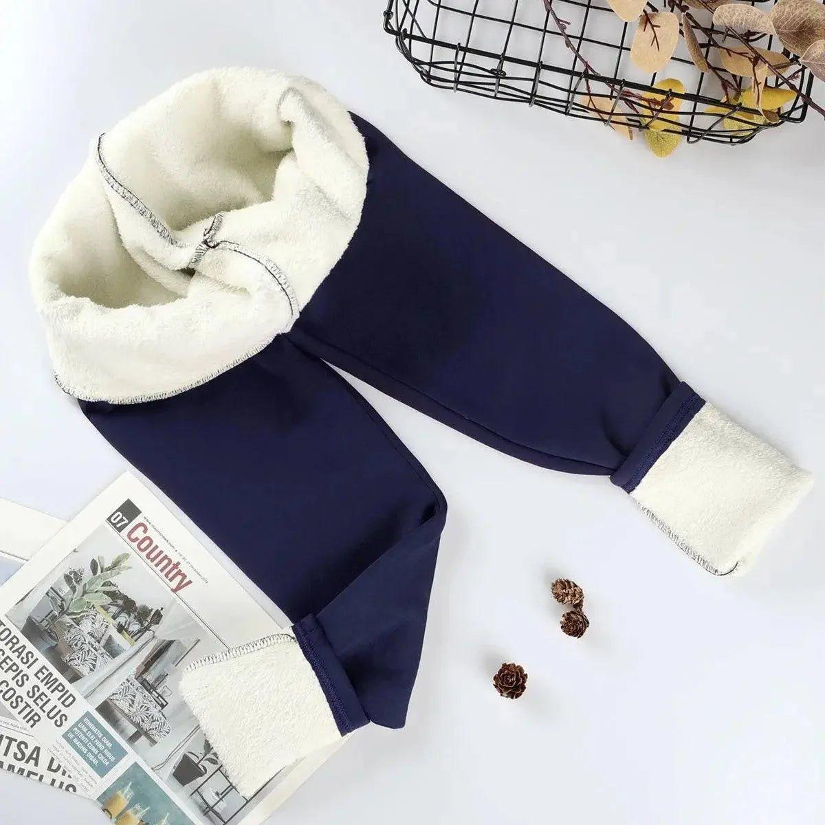 Navy blue fleece-lined joggers with cozy white sherpa interior, perfect for women's winter fashion.