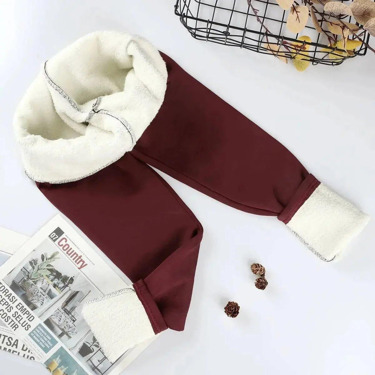 Cozy burgundy fleece-lined women's joggers with white sherpa cuffs, perfect for winter fashion.