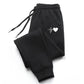 Black women's joggers with white heartbeat heart design, cozy and stylish fashion pants