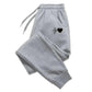Gray women's joggers with black heartbeat heart graphic, cozy casual sweatpants