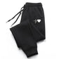 Black women's joggers with white heartbeat heart graphic, cozy casual sweatpants for fashion and comfort