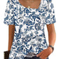 Blue floral print women's blouse with puff sleeves and square neckline, paired with jeans