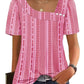 Pink geometric print women's top with puff sleeves and square neckline, paired with jeans