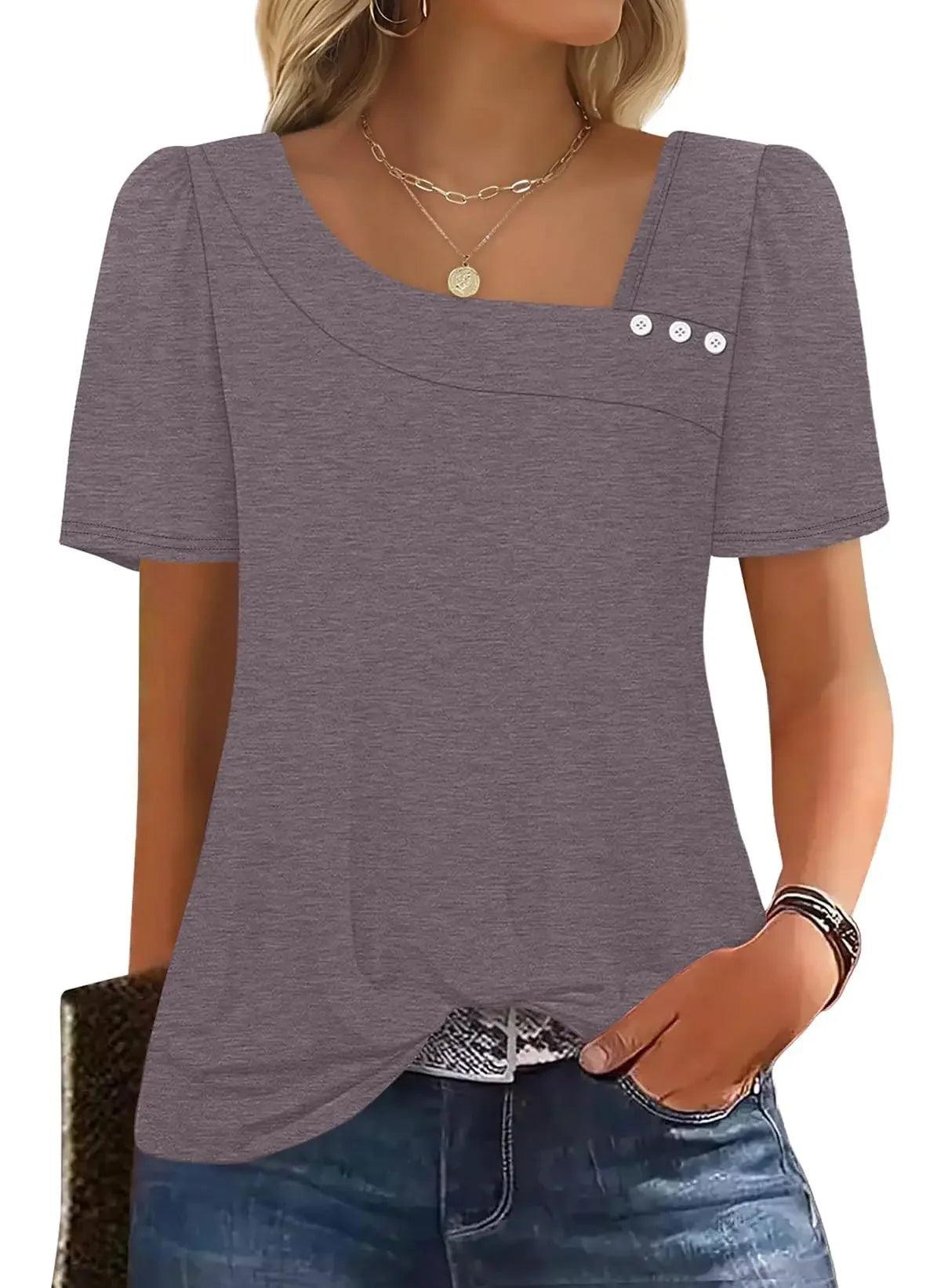 Gray women's short sleeve top with puff sleeves, button detail, and square neckline, paired with jeans
