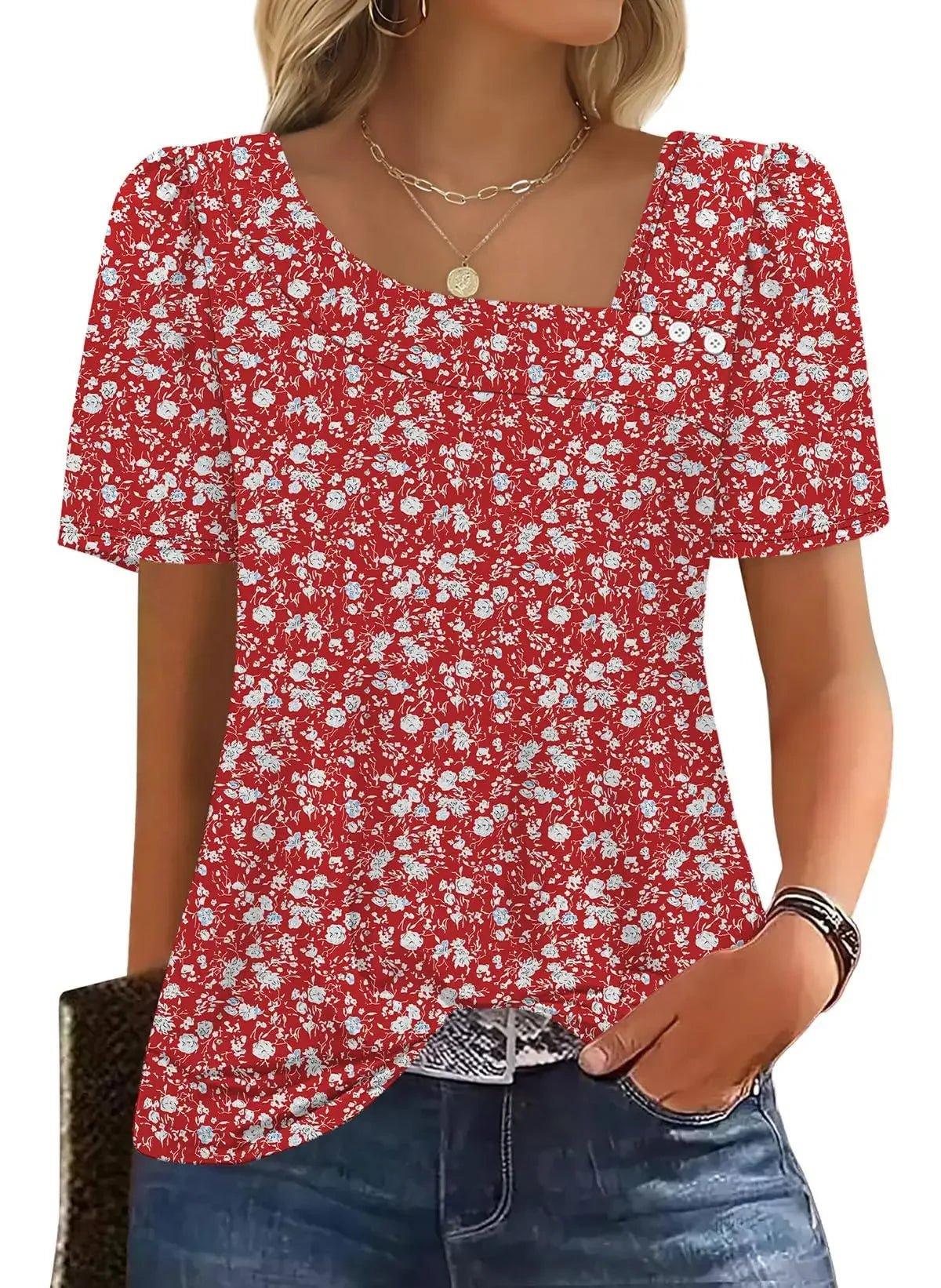 Red floral print women's blouse with puff sleeves and square neckline, paired with jeans