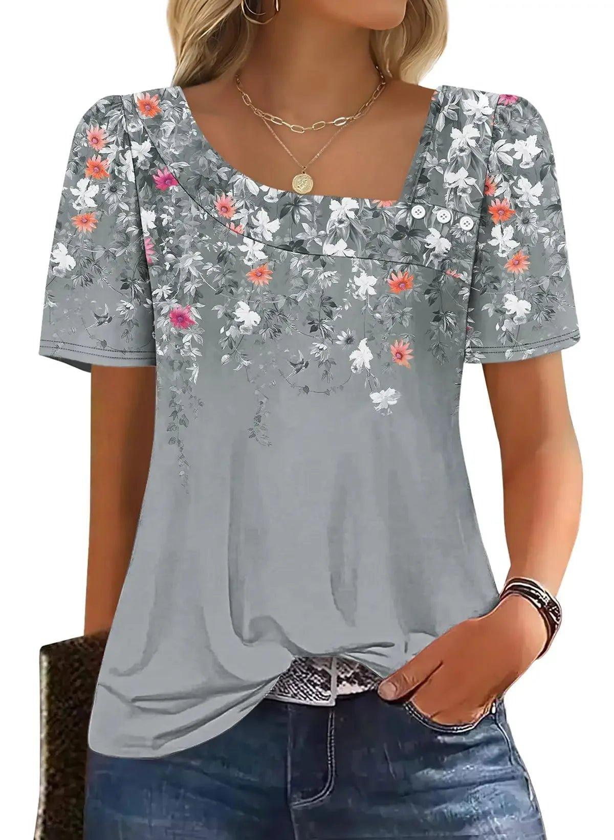 Women's gray floral print top with puff sleeves, square neckline, and front buttons, paired with jeans.