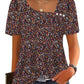 Floral print women's blouse with puff sleeves and square neckline, paired with jeans for casual fashion