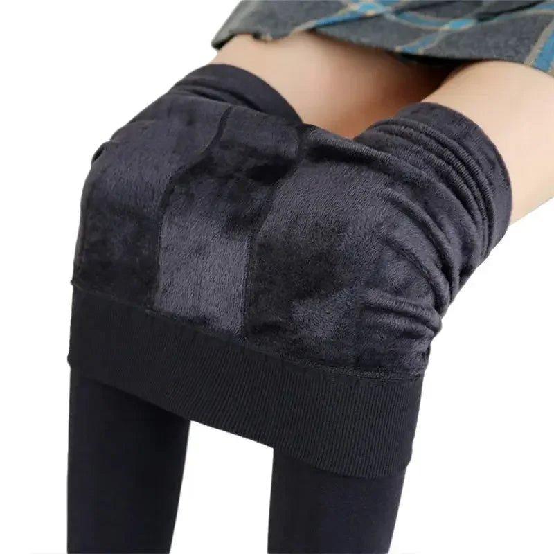 Black women's fleece-lined leggings with ribbed waistband, cozy winter fashion wear
