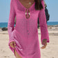 Pink crochet beach cover-up dress with long sleeves and V-neck tie, perfect for summer fashion