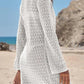White crochet beach cover-up dress with long sleeves, perfect for summer fashion and seaside style